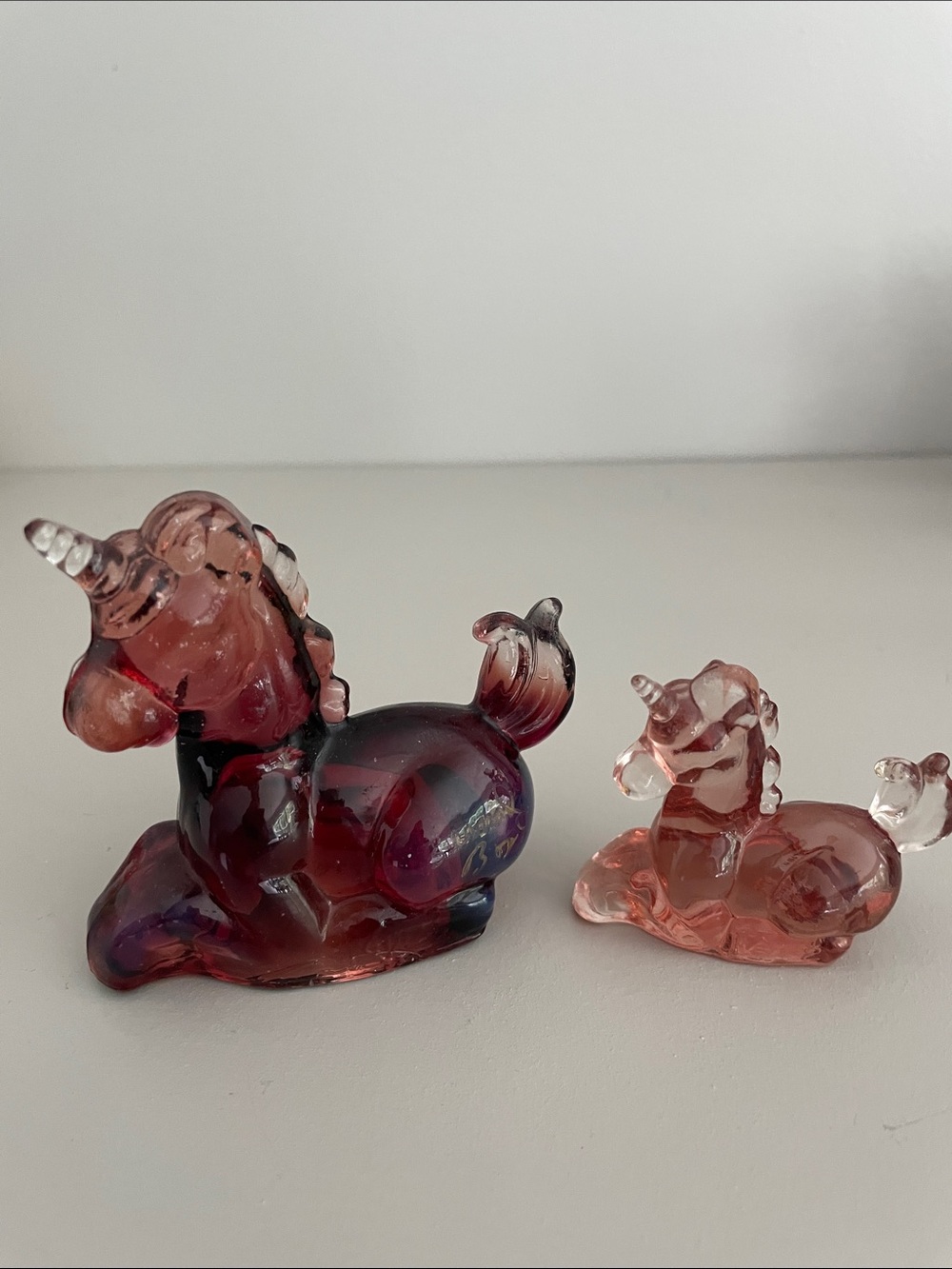 Boyd glass Lucky Unicorn signed, cranberry color. Little lucky and big lucky.